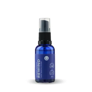 Rewind Detox Spray in a blue glass bottle